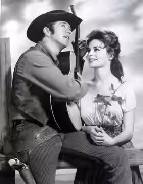 Photo of Clu Gulager as Billy the Kid and Marianna Hill as his sweetheart, Rita, from the television program The Tall Man.