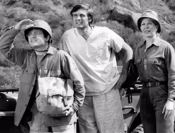 Photo of Gary Burghoff, Alan Alda and Loretta Swit from the television program MAS*H. Radar, Hawkeye and Margaret are on the alert when there's a rumor of an  (1976)