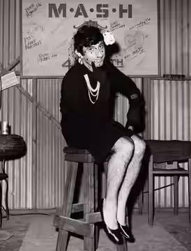 Photo of Jamie Farr as Max Klinger from the television program M.A.S.H.. (1975)