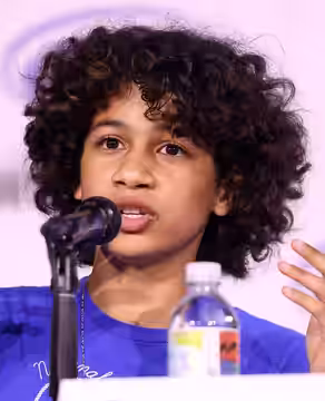Ravi Cabot-Conyers speaking at an event in Anaheim, California. (2025)