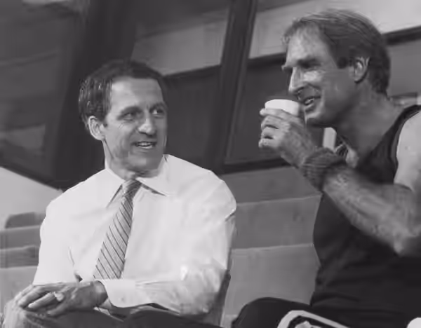 COFFEE AND CONFRONTATION--A battle looms behind the smiles and the coffee cup as Captain Furillo (Daniel J. Travanti, left) threatens to expose of politically s (1983)