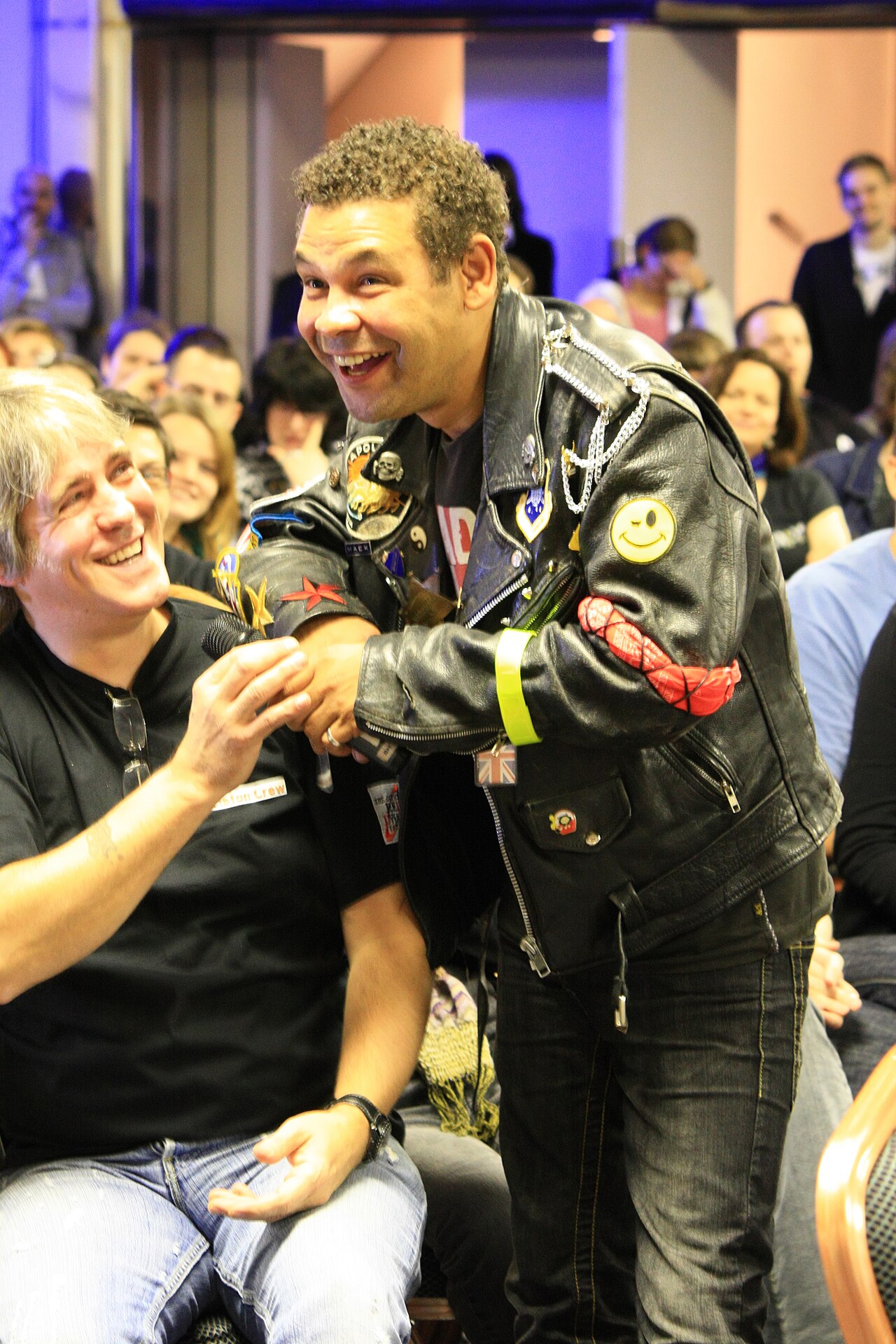 Craig Charles aka Dave Lister from Red Dwarf hamming it up at Dimension Jump XV, Birmingham UK. Wearing a fan's mock up of Lister's jacket and posing for a pict (2009)