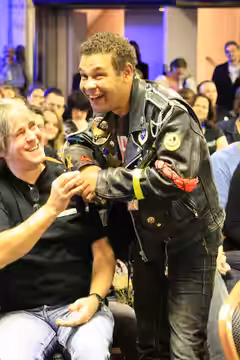 Craig Charles aka Dave Lister from Red Dwarf hamming it up at Dimension Jump XV, Birmingham UK. Wearing a fan's mock up of Lister's jacket and posing for a pict (2009)