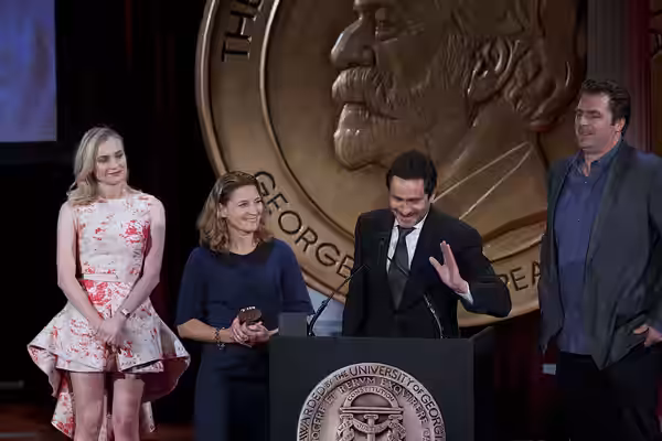 Demian Bechir and Meredith Stiehm accept the Peabody Award for The Bridge. (2014)