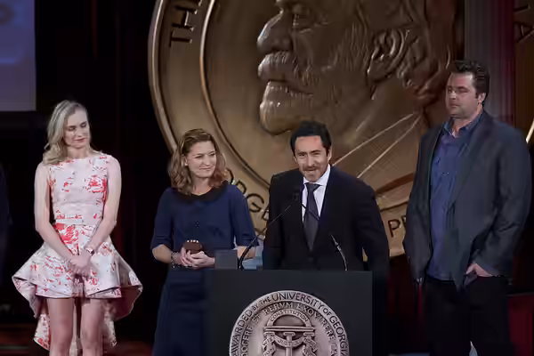 Demian Bechir and Meredith Stiehm accept the Peabody Award for The Bridge. (2014)