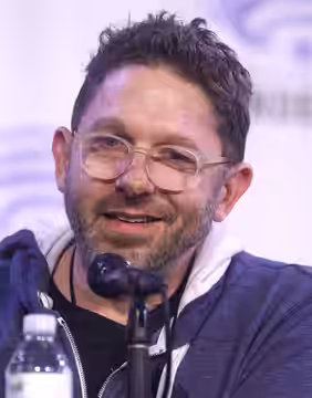 Aaron Ehasz speaking at the 2024 WonderCon in Anaheim, California.