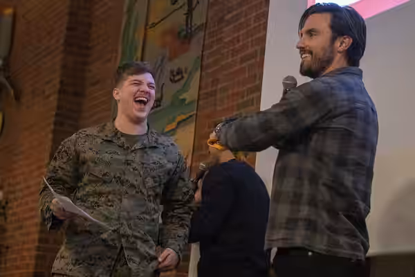 Actor Milo Ventimiglia performs for deployed service members during the Chairman's USO Holiday Tour in Vaernes, Norway, Dec. 21, 2018. Dunford, along with USO e