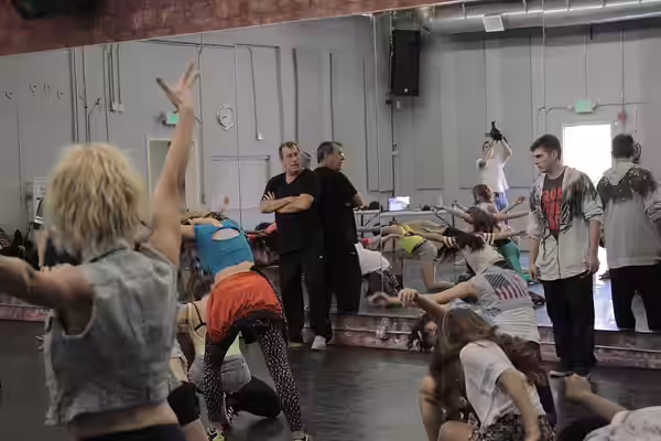 In Los Angeles, Paul Becker and Kenny Ortega hold auditions and give instruction in the dance studio. (2013)