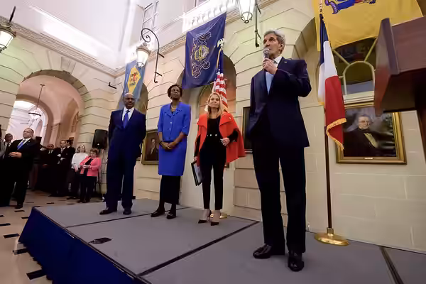U.S. Secretary of State John Kerry - flanked by U.S. Ambassador to Paris Jane Hartley, U.S. Ambassador to UNESCO Crystal Nix-Hines, U.S. Ambassador to the OECD  (2015)