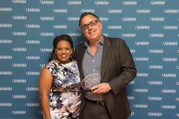 Actress and co-host of the Voice Awards, Chandra Wilson, stands with Patrick Tobin as holds the Voice Award for the film, Cake. Patrick was a writer for the fil (2015)