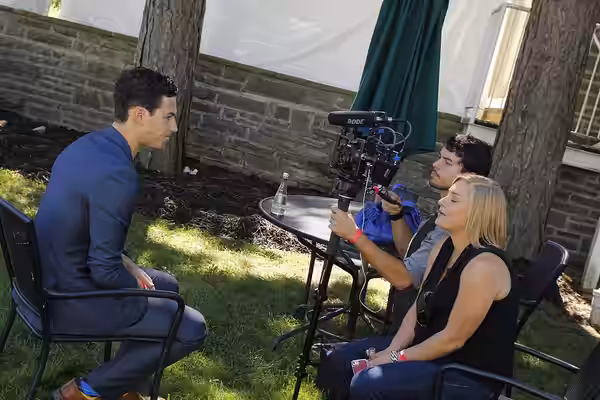 2013 Actors' Conservatory alumnus Giacomo Gianniotti gives an interview at the CFC Annual BBQ Fundraiser. Photos by: Janis Rees/Tom Sandler Photography (2014)