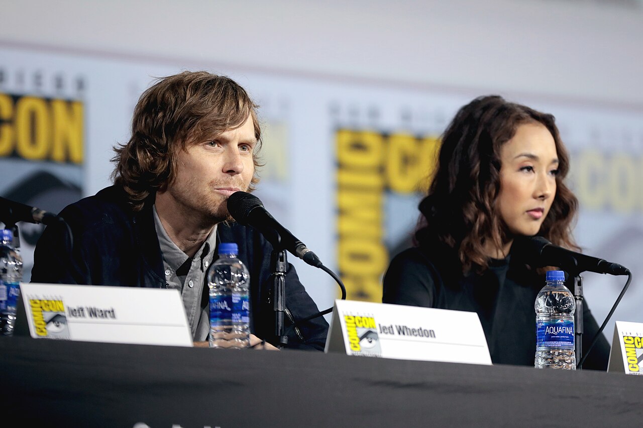 Jed Whedon and Maurissa Tancharoen speaking at the 2019 San Diego Comic Con International, for "Marvel's Agents of S.H.I.E.L.D.", at the San Diego Convention Ce