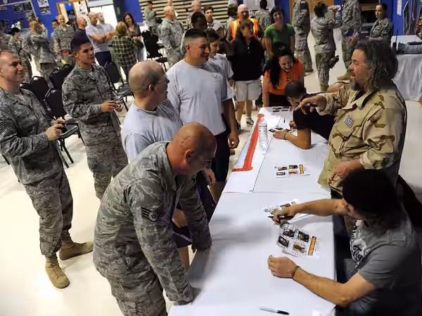 Military and civilian personnel line up to get autographs from the actors of "Sons of Anarchy" at a meet and greet event at Joint Base Balad, Iraq, March 15. Fo (2010)