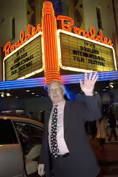 Chevy Chase in front of The Boulder Theater marquee. (2009)