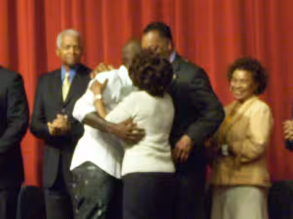 Rep. Maxine Waters and Rev. Jesse Jackson greet recording artist and actor Tyrese Gibson after his performance of the national anthem at a Los Angeles jobs even (2008)