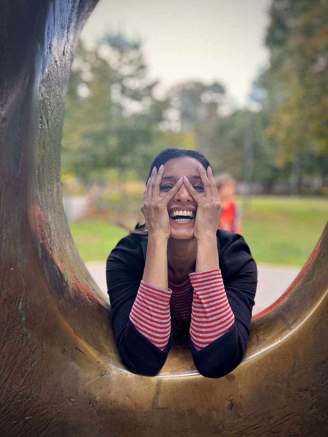 Shelley Conn looking through a Henry Moore sculpture in Toronto, Canada. (2022)