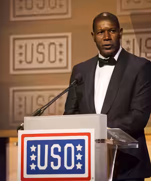 Actor Dennis Yaysbert speaks during the 2013 USO Gala as the USO Master of Ceremonies in Washington, D.C., Oct. 25, 2013. The Assistant Commandant of the Marine