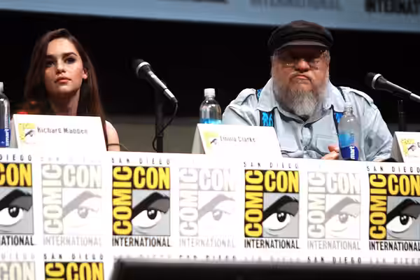 Emilia Clarke and George R. R. Martin speaking at the 2013 San Diego Comic Con International, for "Game of Thrones", at the San Diego Convention Center in San D
