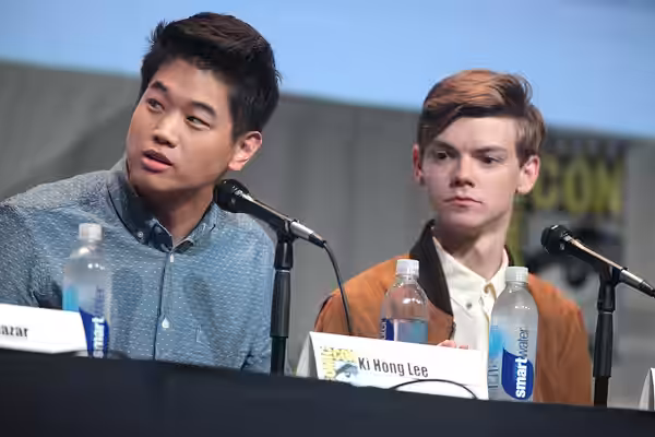 Ki Hong Lee and Thomas Brodie-Sangster speaking at the 2015 San Diego Comic Con International, for "Maze Runner: The Scorch Trials", at the San Diego Convention