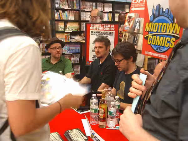 From the left to right: Writers Ed Brubaker, Christos Gage and Matt Fraction at a book signing at Midtown Comics Times Square in Manhattan, June 21, 2010. Photo