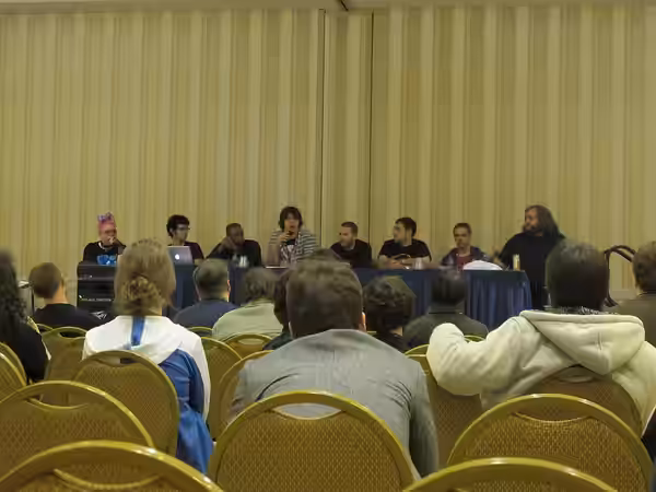 Musicians on the stage during the "Indie Game Musicians Protips and Q&amp;A" panel at MAGFest X in 2012. From left to right, the panelists are Jake "virt" Kaufm