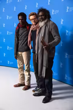 Jacob Junior Nayinggul, Simon Baker and Witiyana Marika presenting the movie High Ground at the Berlinale 2020