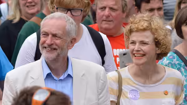 Jeremy Corbyn and Maxine Peake walking together in the procession through the village at the Tolpuddle Martyrs' Festival and Rally 2016.