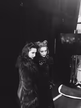 Bella Hadid and Gigi Hadid pose for cameras backstage at the Anna Sui Fall Winter 2017 show at New York Fashion Week, Skylight Clarkston Square, February 15, 20