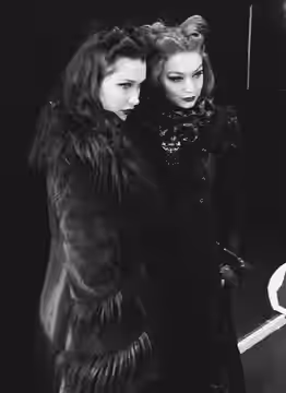 Bella Hadid and Gigi Hadid pose for cameras backstage at the Anna Sui Fall Winter 2017 show at New York Fashion Week, Skylight Clarkston Square, February 15, 20