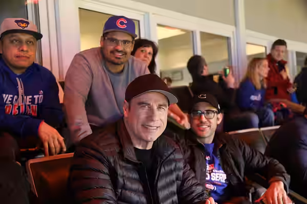 Actors Michael Pena and John Travolta enjoys Game 5 of the 2016 World Series.