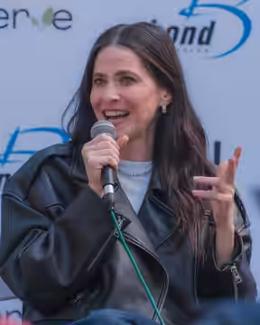 Jackie Tohn speaking at MultiCon 2025 in Los Angeles, California.