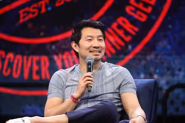Simu Liu speaking with attendees at the 2024 Phoenix Fan Fusion at the Phoenix Convention Center in Phoenix, Arizona. Please attribute to Gage Skidmore if used 