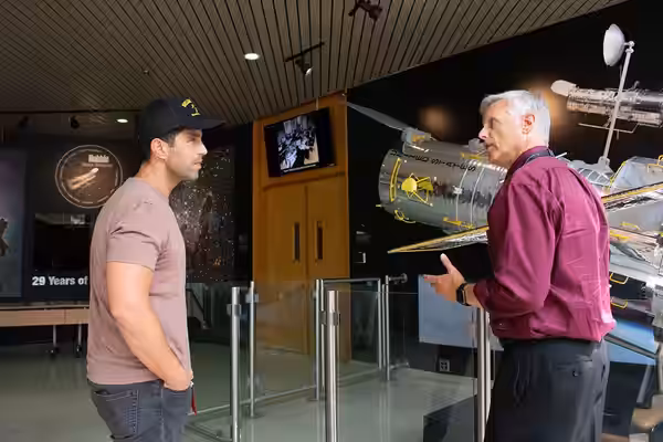 Hubble Space Telescope Deputy Project Manager Jim Jeletic (right) conducts a tour for Josh Peck, American actor and comedian (left), at NASA's Goddard Space Fli