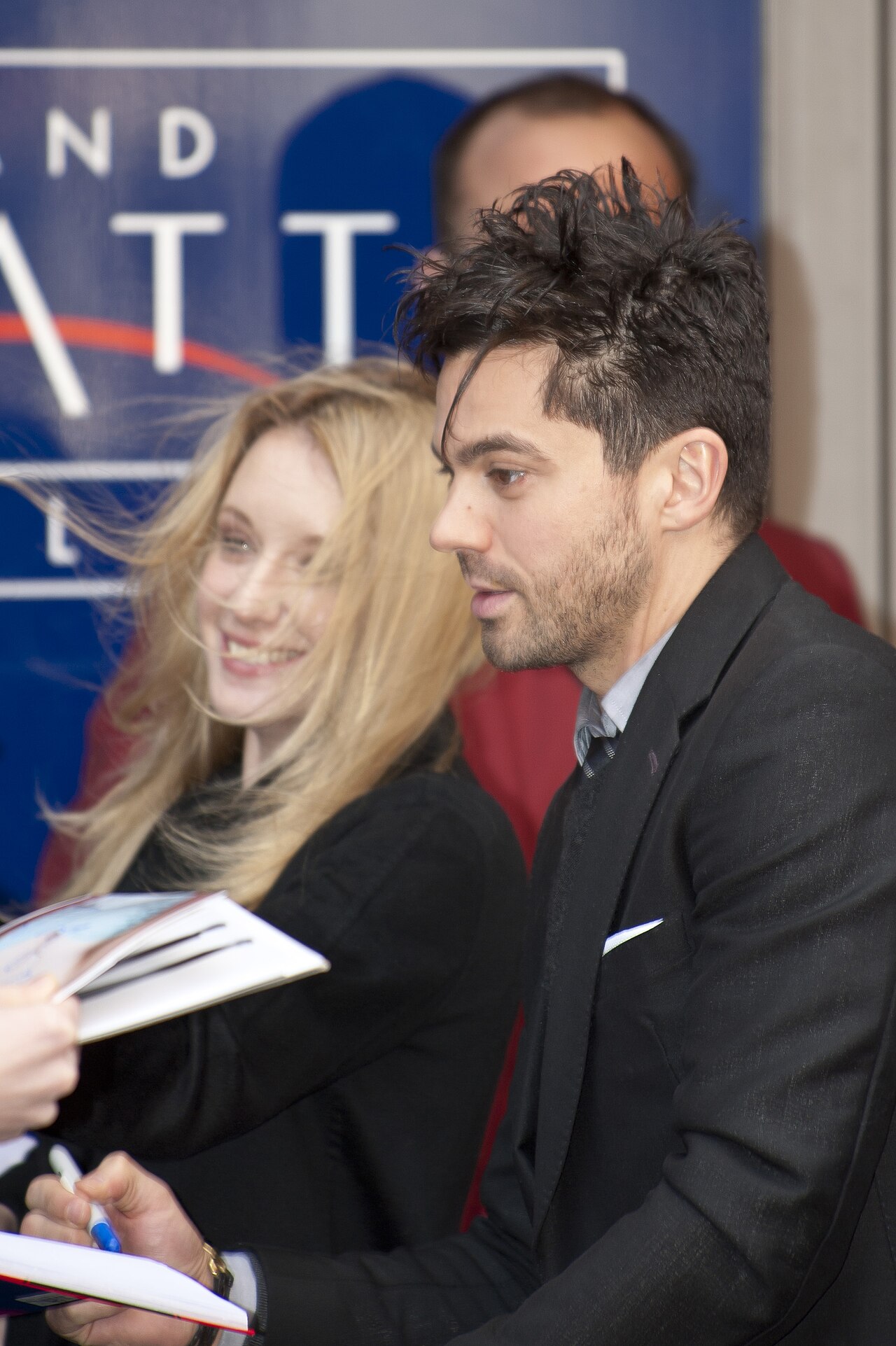 English actor Dominic Cooper and french actress Ludivine Sagnier arriving at the press conference of their movie The Devil's Double at the Berlin Film Festival  (2011)