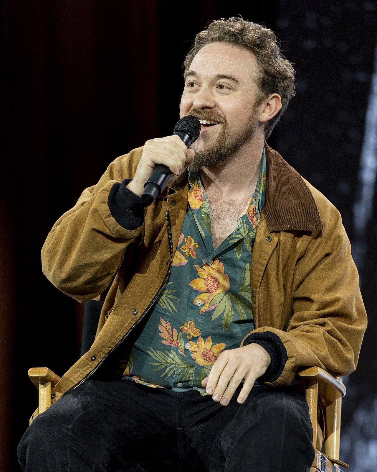 Alex Hirsch addressing the audience during his fireside chat with TheOdd1sOut at Open Sauce 2026 in the San Mateo County Event Center.
