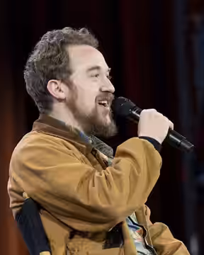 Alex Hirsch, creator of Gravity Falls, speaking during “Fireside Chat: Alex Hirsch × TheOdd1sOut” at Open Sauce 2026 on July 19.