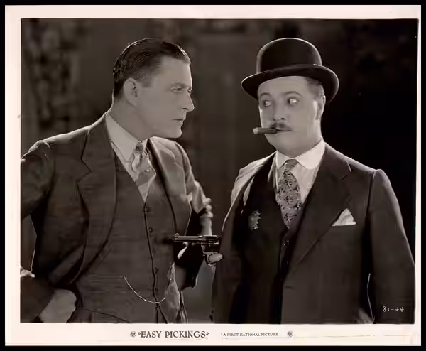 This production still features Kenneth Harlan and Billy Bevan. The film was released by First National Pictures and was a silent mystery film directed by George (1927)