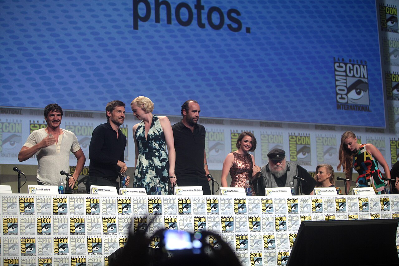 Pedro Pascal, Nikolaj Coster-Waldau, Gwendoline Christie, Rory McCann, Maisie Williams, George R. R. Martin, Natalie Dormer and Sophie Turner speaking at the 20 (2014)