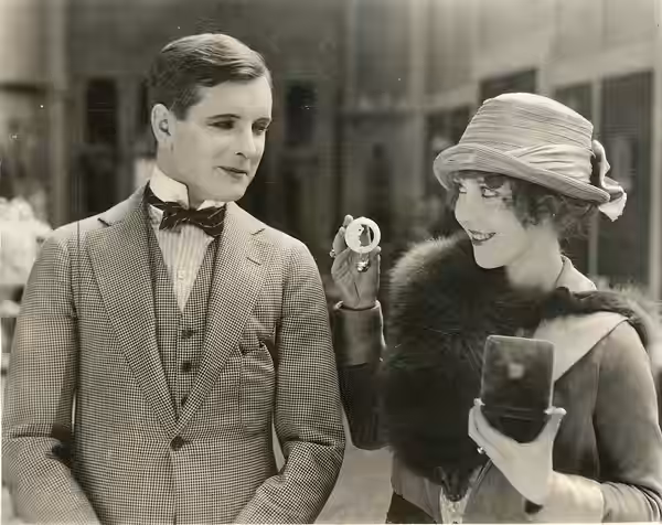 A scene from the American film Oh, Boy! (1919), which played at the Clemmer Theater, Seattle. Includes June Caprice and Creighton Hale. Dated Oct. 19, 1919. Sub