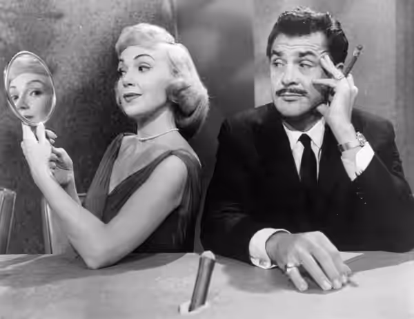 Promotional photo of Ernie Kovacs and Edie Adams from his television show, Take a Good Look. This photo was produced prior to 1978 and has no copyright markings (1960)
