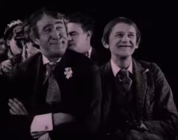 Francis Ford (left) & Si Jenks in The Village Blacksmith - cropped screenshot (1922)