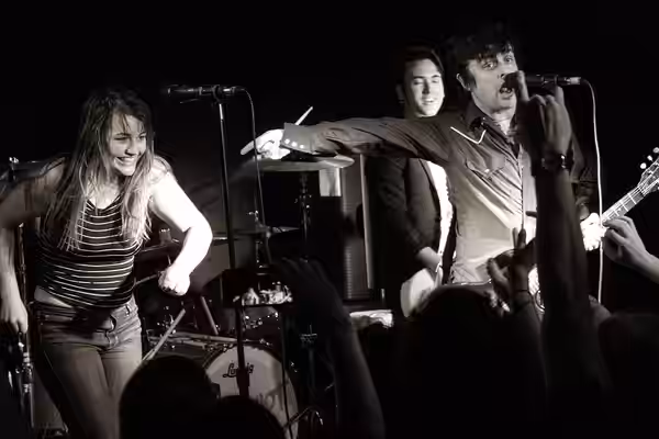 Armstrong performing with the band The Longshot in 2018.