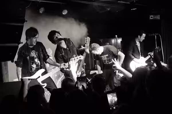 Armstrong performing with the band The Longshot in 2018.