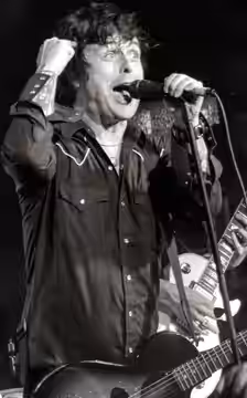 Armstrong performing with the band The Longshot in 2018.