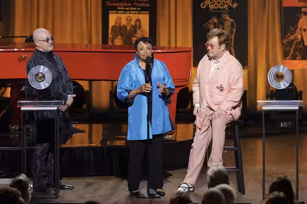 Librarian of Congress Carla Hayden (center) presents the Gershwin Prize for Popular Song to Bernie Taupin and Elton John during a concert in Washington on Wedne (2024)