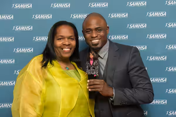 Keris Myrick and Wayne Brady pose with Advocacy Barbie. (2015)