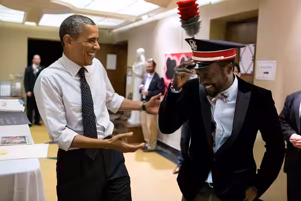 President Barack Obama talks with will.i.am, following an event The Ohio State University in Columbus, Ohio, Oct. 9, 2012. (Official White House Photo by Pete S
