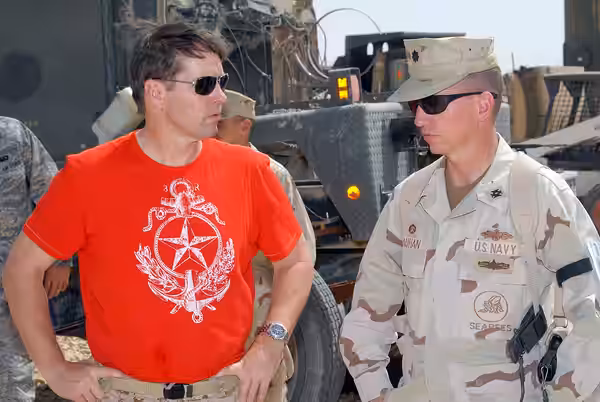 Actor D.B. Sweeney receives a tour of the Naval Mobile Construction Battalion (NMCB) 17 Camp RJ NMCB-17 commanding officer Cmdr. Thomas Bauhan. Sweeney visited  (2008)