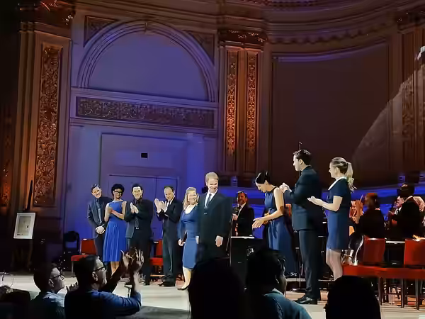 "We Chose to Go to the Moon" performers (left to right) Claybourne Elder, Joy Woods, Skylar Astin, John Monsky, Kali Armstrong, Mark Armstrong, Elizabeth Gillie (2026)