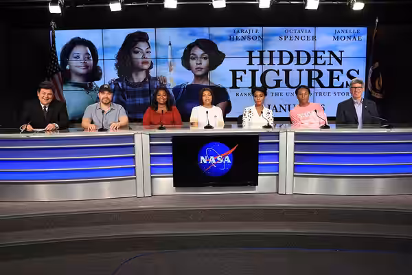 In the Press Site auditorium at the Kennedy Space Center in Florida, members of the media participate in a news conference with key individuals from the upcomin (2016)